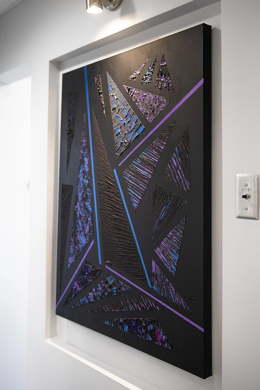 Textured triangles in blue to purple by Dr. Ahmed