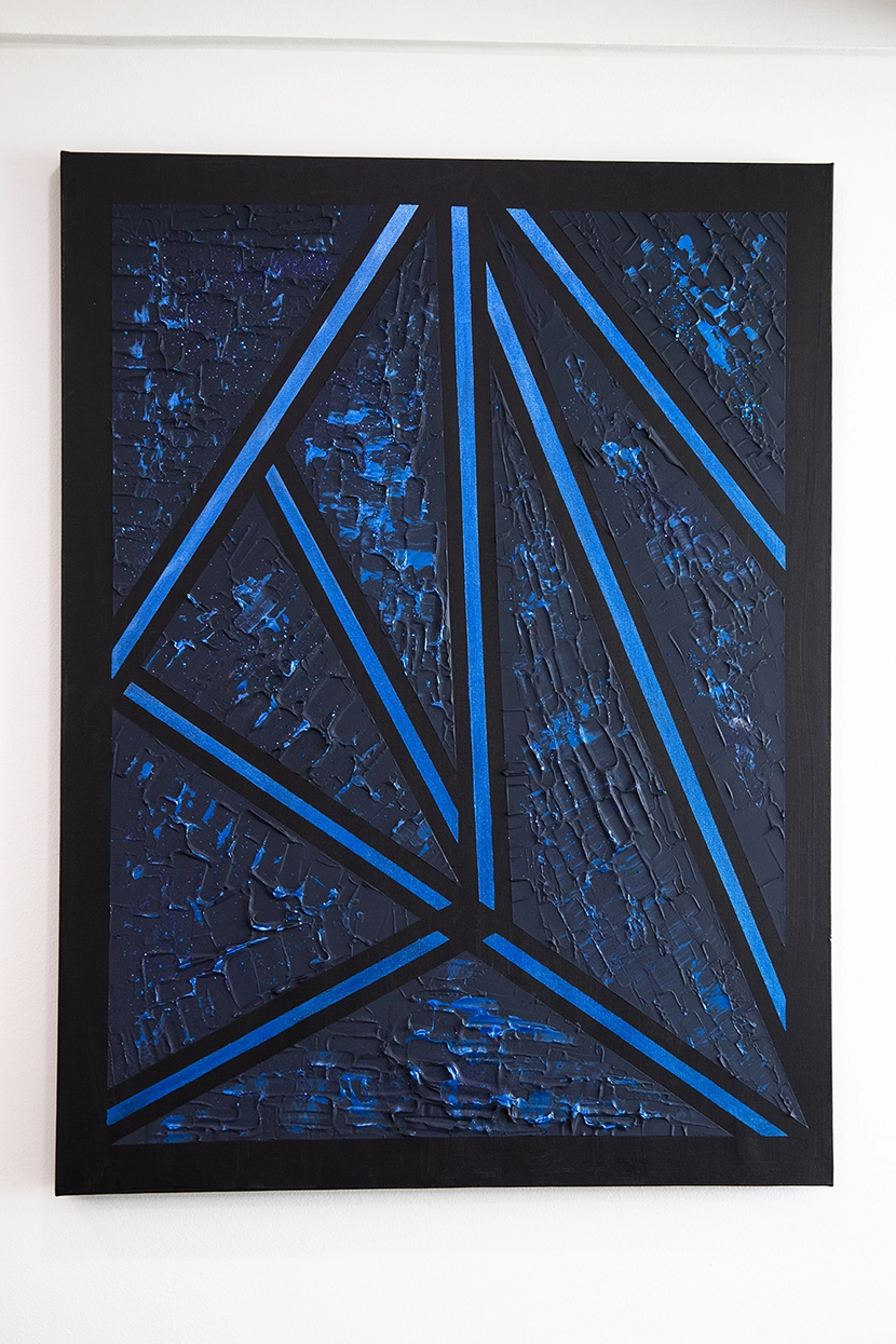 Triangular blue shapes on black by Dr. Ahmed