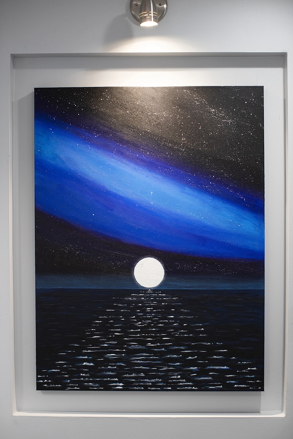 The moon over the ocean at night by Dr. Ahmed