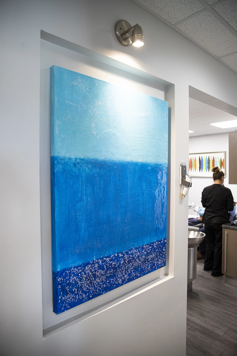 Three stacked blue lines by Dr. Ahmed